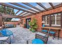 Inviting covered patio with brick accents, outdoor seating, and a pergola offering a cozy space at 6314 N 14Th Pl, Phoenix, AZ 85014