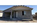 Charming single-Gathering home featuring a stucco exterior, covered porch, and attached garage for modern living at 7701 W Avenida Del Rey --, Peoria, AZ 85383