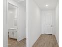 Bright hallway leading to a bathroom and front door at 7701 W Avenida Del Rey --, Peoria, AZ 85383