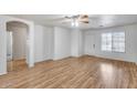Spacious living room with wood-look flooring and an abundance of natural light at 849 E Impreria St, San Tan Valley, AZ 85140