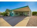Spacious carport providing ample covered parking and access to the home's entrance and additional storage at 8500 E Southern Ave # 447, Mesa, AZ 85209
