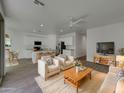 Open floor plan featuring a spacious living room, kitchen, and dining area at 9327 E Static Ave, Mesa, AZ 85212