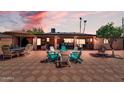 Inviting backyard with brick patio, comfortable seating, outdoor bar and a charming citrus tree at 10602 N 35Th St, Phoenix, AZ 85028