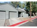 Inviting two-story townhouse with a private garage and well-maintained wood-clad exterior at 14002 N 49Th Ave # 1094, Glendale, AZ 85306