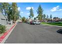 Well maintained parking lot with ample parking space and beautiful surrounding landscape at 14002 N 49Th Ave # 1094, Glendale, AZ 85306