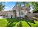 Beautiful home with well-maintained lawn and tasteful landscaping enhancing its curb appeal at 1427 E Palomino Dr, Gilbert, AZ 85296