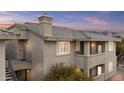 Charming condo featuring stucco walls, tiled roof, and private balconies, perfect for enjoying outdoor living at 16013 S Desert Foothills Pkwy # 2120, Phoenix, AZ 85048