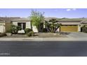 Charming single-story home features a two-car garage and desert landscaping at 19746 N Heron Ct, Maricopa, AZ 85138