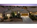 Beautiful single-story home featuring a well-manicured front yard and attached two-car garage at 19746 N Heron Ct, Maricopa, AZ 85138
