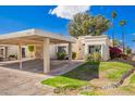 Charming single-story home featuring a covered carport and well-maintained landscaping in a desirable neighborhood at 2714 W Desert Cove Ave, Phoenix, AZ 85029
