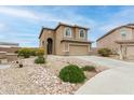 Beautiful two-story home showcasing desert landscaping and an attached two-car garage at 284 N 199Th Dr, Buckeye, AZ 85326