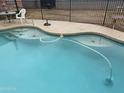 Refreshing pool with crystal-clear water and well maintained concrete patio area at 306 N Winthrop Cir, Mesa, AZ 85213