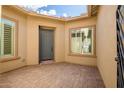 Charming front porch with tiled flooring and ample natural light at 32297 N 133Rd Ln, Peoria, AZ 85383