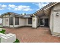 Inviting single-story home with brick-paved driveway and desert-inspired landscaping at 4918 W Butler Dr, Chandler, AZ 85226