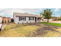 Charming single-story home featuring a low maintenance front yard and a convenient carport at 5016 N 68Th Dr, Glendale, AZ 85303
