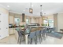 Modern kitchen with a large island, pendant lighting, and stainless steel appliances at 10148 W Avenida Del Rey --, Peoria, AZ 85383