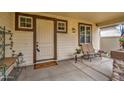 Cozy front porch with a seating area, perfect for relaxation, and charming decorative elements at 1155 S Annie Ln, Gilbert, AZ 85296