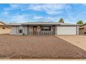 Charming single-story home with gray brick, low maintenance yard and two car garage at 14013 N Boswell Blvd, Sun City, AZ 85351