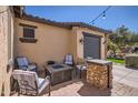 Outdoor patio featuring stylish seating arrangements around a modern fire pit at 14870 W Aldea Cir, Litchfield Park, AZ 85340