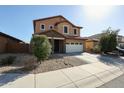 Two-story home features a two car garage and low maintenance desert landscaping at 1713 W Cottonwood Ln, Phoenix, AZ 85045