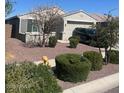 Lovely front yard displaying mature landscaping and a cozy home at 18642 W Yucatan Dr, Surprise, AZ 85388