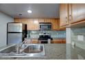 Well-lit kitchen featuring stainless steel appliances and granite countertops at 200 E Southern Ave # 316, Tempe, AZ 85282