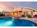 Backyard pool and patio area perfect for outdoor entertaining at 20640 N 100Th Ln, Peoria, AZ 85382