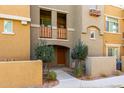 Charming townhome entrance with a private balcony and well-manicured landscaping adding curb appeal at 240 W Juniper Ave # 1146, Gilbert, AZ 85233