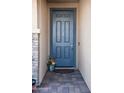 Inviting front door with brick accents and a decorative fall-themed arrangement at 2849 W Apollo Rd, Phoenix, AZ 85041