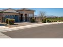 Attractive single-Gathering home with a blue garage door, desert landscaping, and charming curb appeal at 2849 W Apollo Rd, Phoenix, AZ 85041