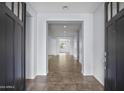 Bright entryway featuring tile flooring, neutral paint, and a clear view to the back of the home at 2923 E Preston St, Mesa, AZ 85213