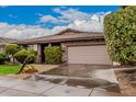 Charming single-story home featuring beautiful landscaping, a two-car garage and stone accents at 3881 S Marion Way, Chandler, AZ 85286