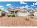 Charming single-story home featuring a tiled roof, spacious two-car garage, and low-maintenance desert landscaping at 4145 W Columbine Dr, Phoenix, AZ 85029