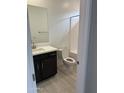 Bathroom featuring a single sink vanity with black cabinets and a white countertop at 43387 N Wollemi St, Queen Creek, AZ 85140