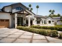 Beautiful home with a manicured lawn, landscaped garden, and striking curb appeal at 6114 E Calle Del Norte --, Scottsdale, AZ 85251