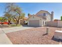 Single Gathering home with desert landscaping and spacious driveway at 9211 W Charleston Ave, Peoria, AZ 85382