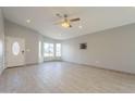 Bright living room featuring recessed lighting, ceiling fan, and bay windows at 9965 W Devonshire Dr, Arizona City, AZ 85123