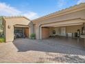 Spacious three car garage featuring epoxy floors and custom built-in cabinets at 10829 E Volterra Ct, Scottsdale, AZ 85262