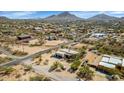 Expansive aerial view showcasing a desert home with horse property at 1345 E Gaffney Rd, New River, AZ 85087