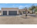 Modern home exterior with two-car garage and landscaped entry at 1345 E Gaffney Rd, New River, AZ 85087