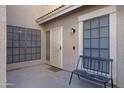 Inviting front porch with secure gate, bench, and decorative front door at 13824 S 41St Way, Phoenix, AZ 85044