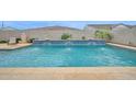 Relaxing backyard pool with fountains and landscaping, perfect for outdoor entertaining and enjoying sunny days at 1547 E Crescent Way, Gilbert, AZ 85298