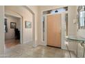 Inviting foyer features tile flooring, neutral walls, and views into the living spaces at 17810 W Club Vista Dr, Surprise, AZ 85374