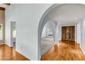 Elegant archways and hardwood flooring create a warm, inviting atmosphere in this home at 2053 W Natal Cir, Mesa, AZ 85202