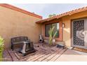 Cozy courtyard featuring brick flooring, potted plants, an outdoor bench, and a decorative cactus at 2450 W Keating Ave, Mesa, AZ 85202