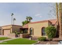 Inviting single-story home with well-maintained desert landscaping and an attached two-car garage at 2450 W Keating Ave, Mesa, AZ 85202