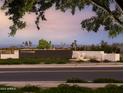 Community entrance featuring modern signage, manicured landscaping, and elegant stone accents at 3588 W Horse Trail Way, San Tan Valley, AZ 85144