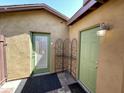 Private exterior courtyard featuring green door and an outdoor shelf at 7226 N 31St Ave, Phoenix, AZ 85051