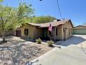 Quaint single-story house with desert landscaping, a cozy porch, and detached garage nearby at 7226 N 31St Ave, Phoenix, AZ 85051