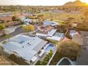 Overhead view showcasing the surrounding neighborhood, offering a glimpse of nearby parks and houses at 8114 E Arlington Rd, Scottsdale, AZ 85250